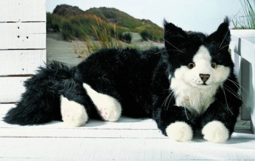 black and white cuddly toy cat